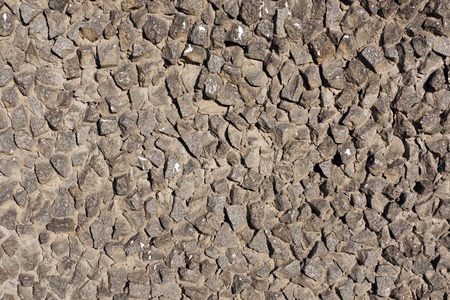 Gray stone stylized wall texture. Architectural background.の写真素材