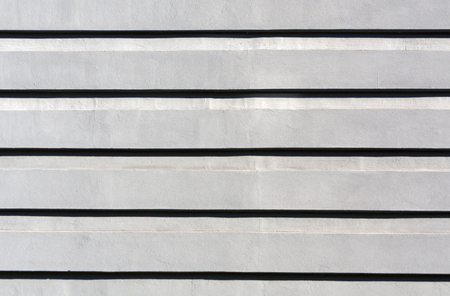 Gray color stylized plaster wall texture. Architectural background.の写真素材