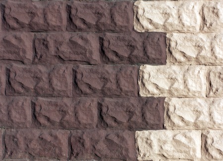 Two color brick stylized wall. Architectural background.
