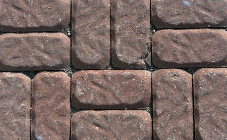 Old red pavement closeup. Architectural and urban background.の写真素材