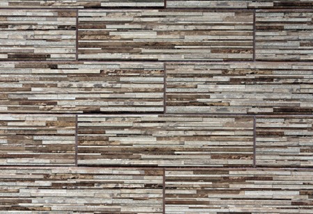 Stylized wall structure with brown and gray stones. Architectural backgroundの写真素材