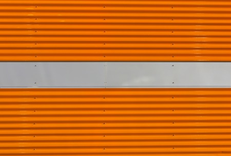 Orange and gray metal wall texture. Architectural background.の写真素材