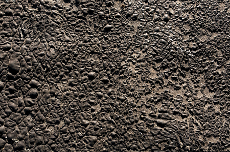 Old black plaster wall texture. Architectural background.の写真素材