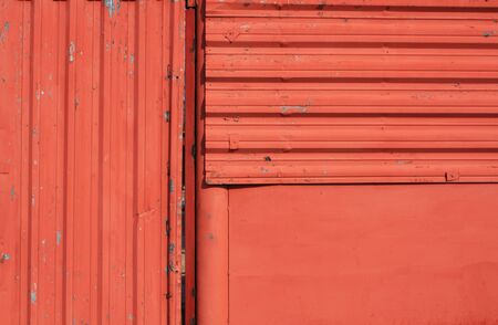 Red grungy metal wall texture. Architectural backgroundの写真素材
