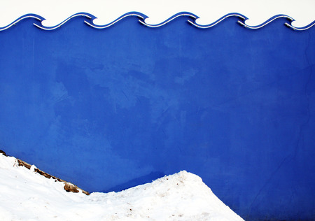 Wave color wall texture with snow. Architectural background.の写真素材