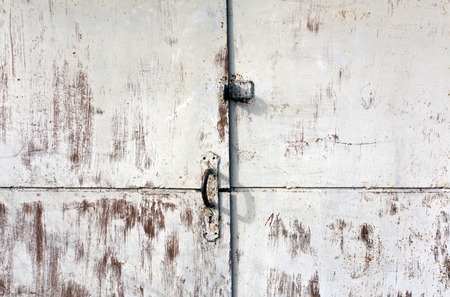 Old rusty metal gate. Architectural background.の写真素材