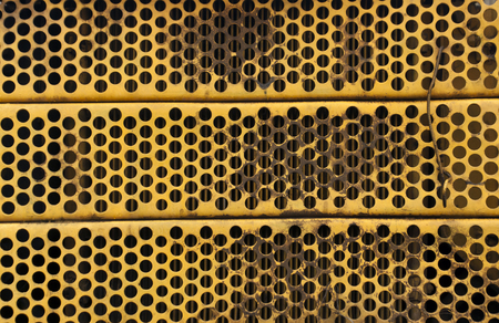 Yellow Metal radiator grid. Background and texture.の写真素材