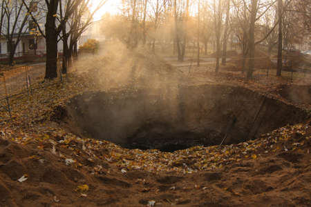 Fog over deep hole. Industrial background.の写真素材