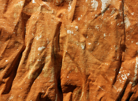 Dirty red textile texture in white paint. Background and texture for design.