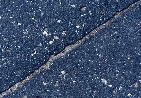 Grungy cracked asphalt textureの写真素材