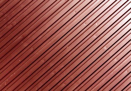Red metal plate surface. Abstract background and texture for design.の写真素材