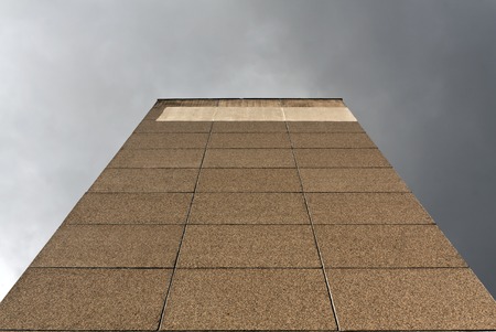 Wall of residential building against dark sky. Architectural background with space for your text.の写真素材