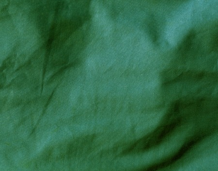 Green color textile cloth surface. Abstract background and texture for design.の写真素材