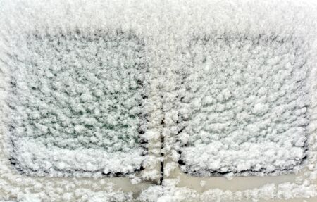 Car window in snow. Abstract seasonal background and texture.の写真素材