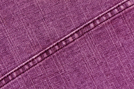 Pink jeans cloth texture with stitch. Abstract background and texture for design.