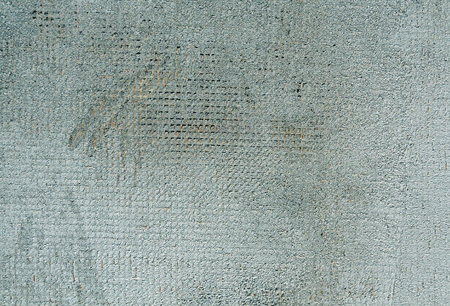 Weathered cyan color cement wall surface. Abstract background and texture for design.の写真素材