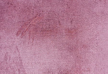 Weathered pink color cement wall surface. Abstract background and texture for design.の写真素材
