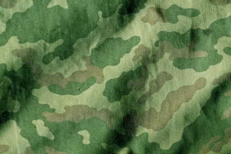 Weathered camouflage cloth texture. Abstract background and texture for designの写真素材