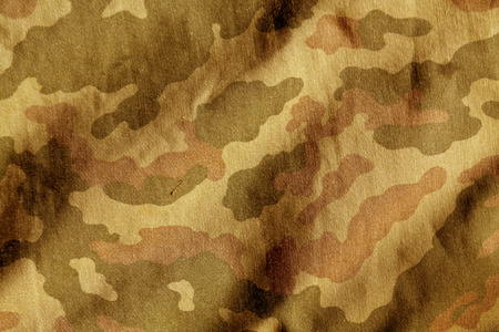 Weathered camouflage cloth texture. Abstract background and texture for designの写真素材