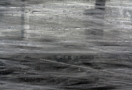 PVC wrap surface with water drops. Abstract color background and texture for design.の写真素材