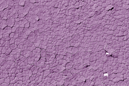 Violet color cracked plaster wall pattern. Abstract background and texture for design.の写真素材