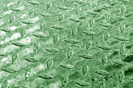 Close-up of green metal floor pattern with blur effect. abstract background and texture for design.の写真素材
