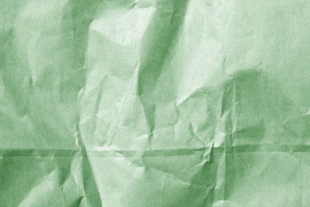 wrinckled green color paper surface. Abstract background and texture for design.の写真素材