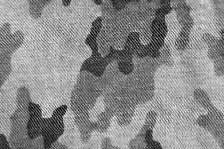 Weathered black and white  old camouflage uniform pattern. abstract background and texture for designの写真素材