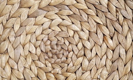 Natural color straw mat surface with round pattern. Abstract background and texture for design.の写真素材