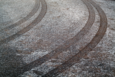 Car track on snowy road. Abstract background and pattern.の写真素材