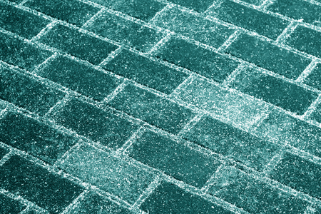 Snow on pavement texture in cyan tone. Abstract background and pattern.の写真素材