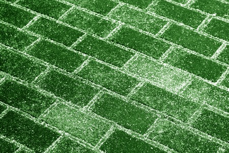Snow on pavement texture in green tone. Abstract background and pattern.の写真素材