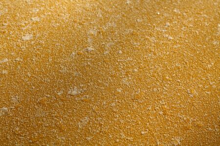 Frost on yellow color metal car top with blur effect. Abstract background and texture for design.の写真素材