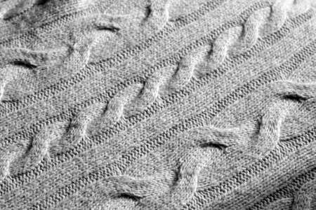 Knitting pattern in black and white. Abstract background and texture for design.