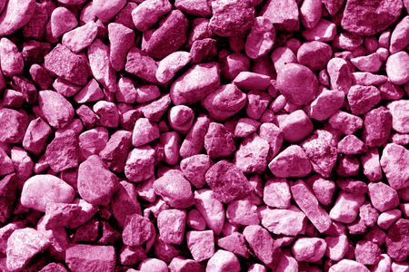 Pile of small gravel stones in pink tone. Seasonal natural background.の写真素材