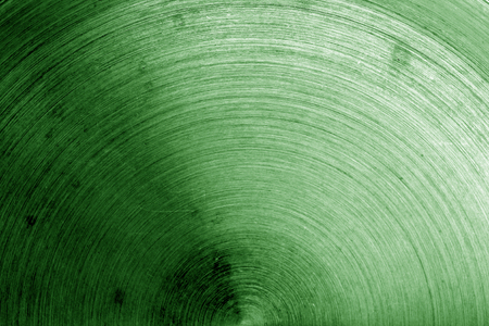 Metal surface with scratches in green tone. Abstract background and texture for design.の写真素材