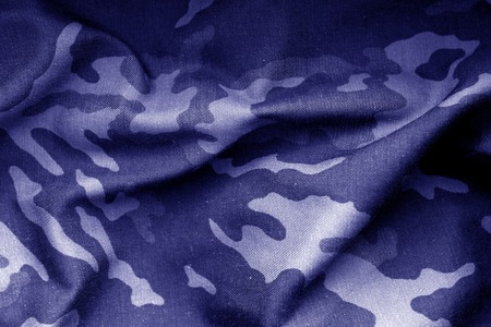 Military uniform pattern with blur effect in blue tone. Abstract background and texture.の写真素材
