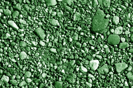 Pile of small gravel stones in green tone. Seasonal natural background.の写真素材