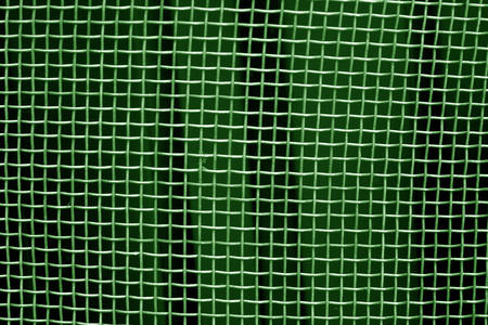 Metal mesh grid pattern in green tone. Abstract background and texture.の写真素材