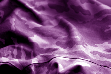 Military uniform pattern with blur effect in purple tone. Abstract background and texture.の写真素材