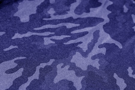 Old camouflage cloth with blur effect in blue tone. Abstract background and texture for design abd ideas.の写真素材