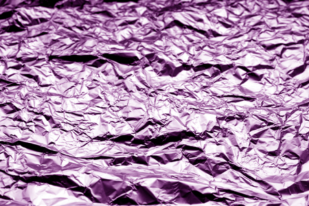 Metal foil texture with blur effect in purple color. Abstract background and texture for design.の写真素材