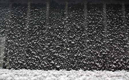 Snow and frost on window. Abstract background and texture.の写真素材