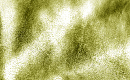 Natural leather on sun in yellow color. Abstract background and texture for design.の写真素材