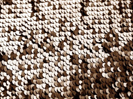 Glittering sequin texture in brown color. Abstract background and texture for design.