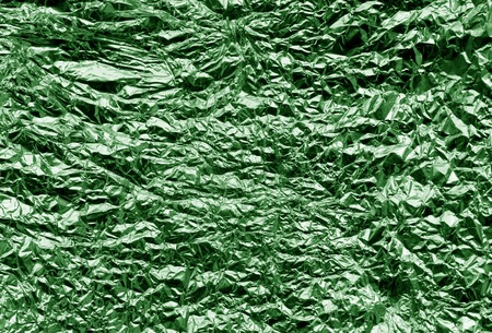 Metal foil texture in green color. Abstract background and texture for design.の写真素材