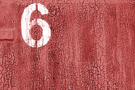 Number 6 in stencil on rusty metal wall in red color. Abstract background and texture for design.の写真素材
