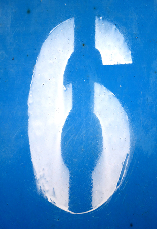 Number 6 in stencil on blue grungy metal wall. Abstract background and texture for design.の写真素材