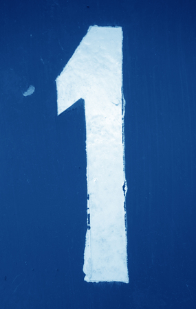 Number 1 in stencil on metal wall in navy blue tone. Abstract background and texture for design.の写真素材