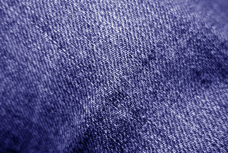 Jeans cloth pattern in blue color with blur effect. Abstract background and texture for design.の写真素材